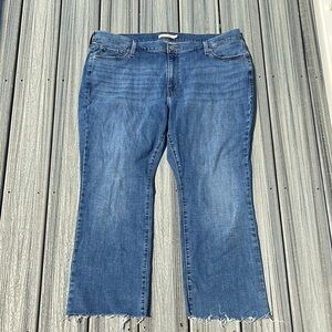 Levi’s - 415 classic boot - medium wash blue jeans - raw hem - size 22W